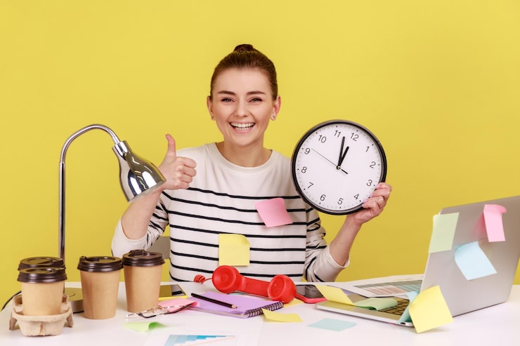 Person smiling and holding a clock, surrounded by sticky notes, coffee cups, and office items on a yellow background