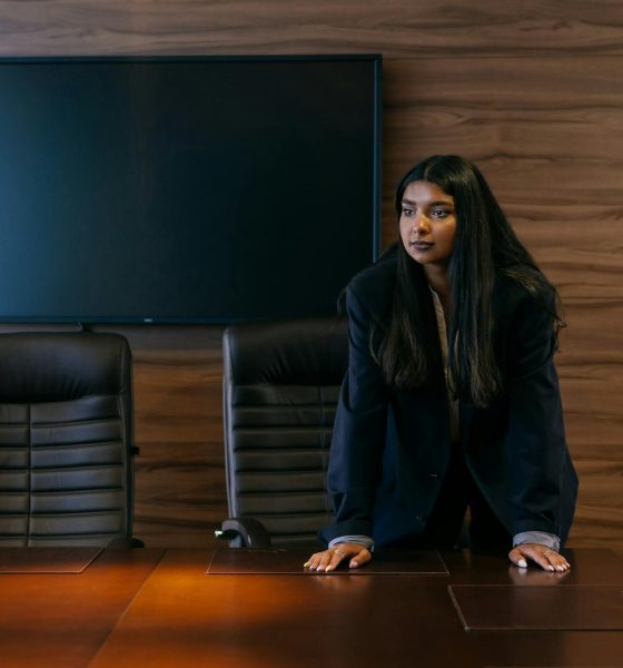 A strong female leader in a stylish conference room, showcasing empowerment and professionalism